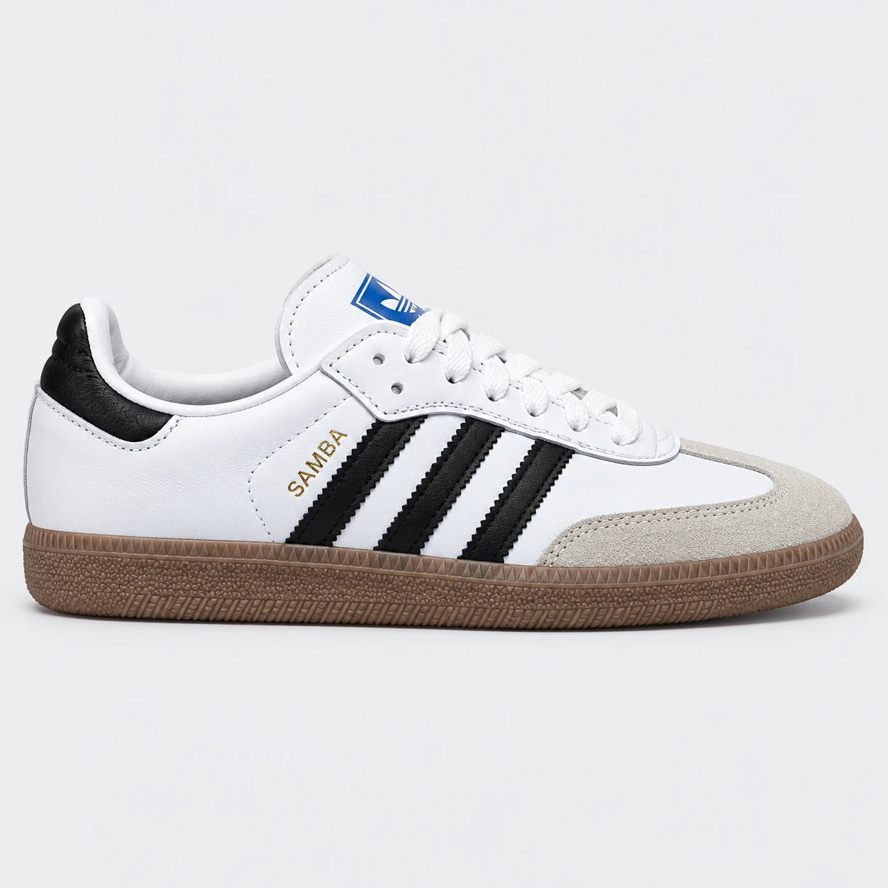 adidas Samba — White / Black / Gum White / Black / Gum low-top sneaker with lace-up fastening, layered panels and three-stripe detailing. Browse the cleaned catalogue image and original supplier photo, and select your UK size from 3 to 9.