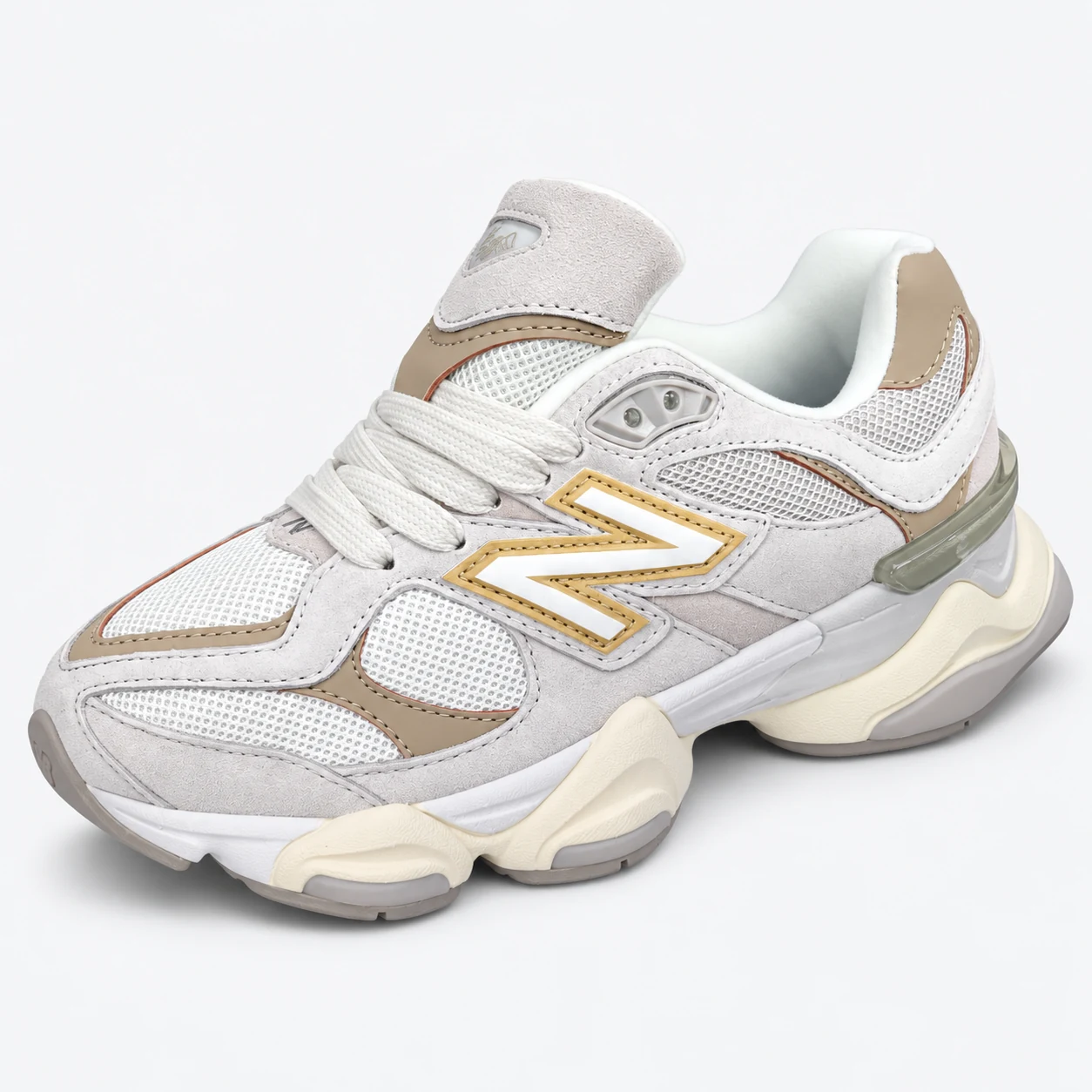 New Balance 9060 — Light Grey / Beige / Cream Light Grey / Beige / Cream low-top sneaker with lace-up fastening, layered panels and visible N branding. Browse both the cleaned catalogue image and original supplier photo, and select your UK size from 3 to 9.