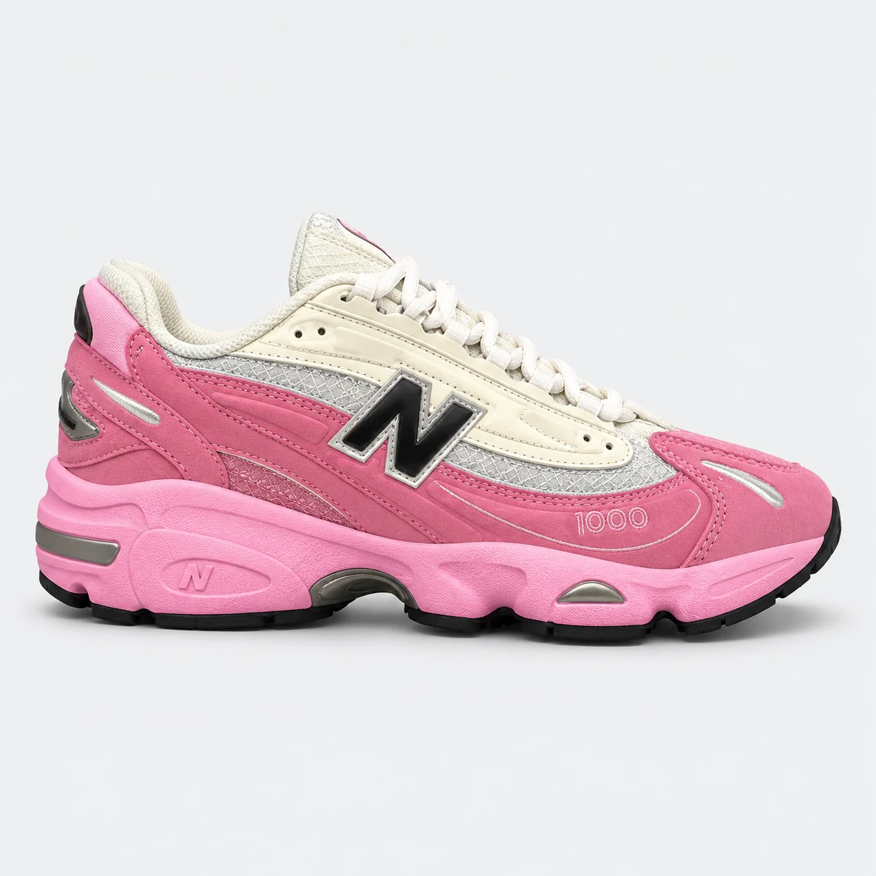 New Balance 1000 — Pink / Cream / Black Pink / Cream / Black low-top sneaker with lace-up fastening, layered panels and visible N branding. Browse both the cleaned catalogue image and original supplier photo, and select your UK size from 3 to 9.